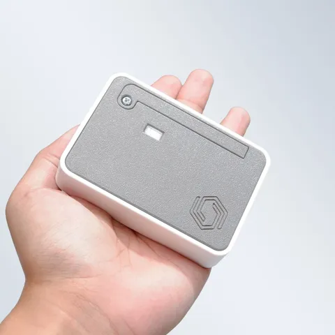 Cubicore Gateway Pocket held in a hand showing its compact size